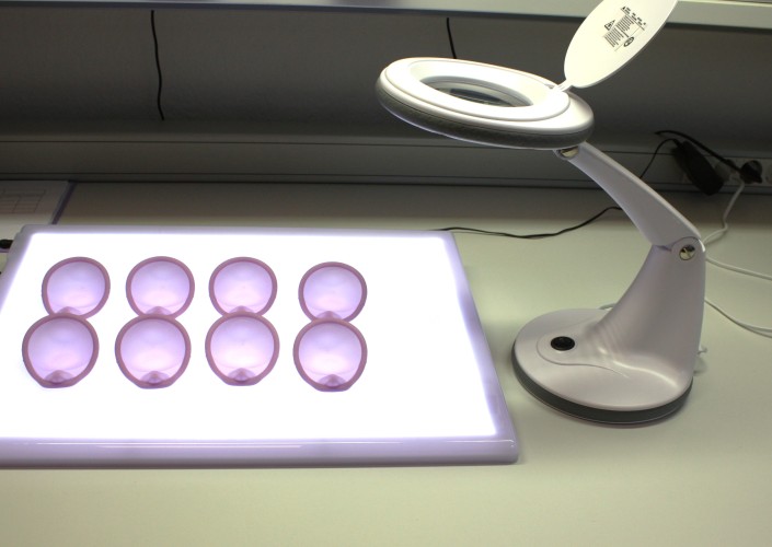 final  quality control at the light table before Caya diaphragms are packed 